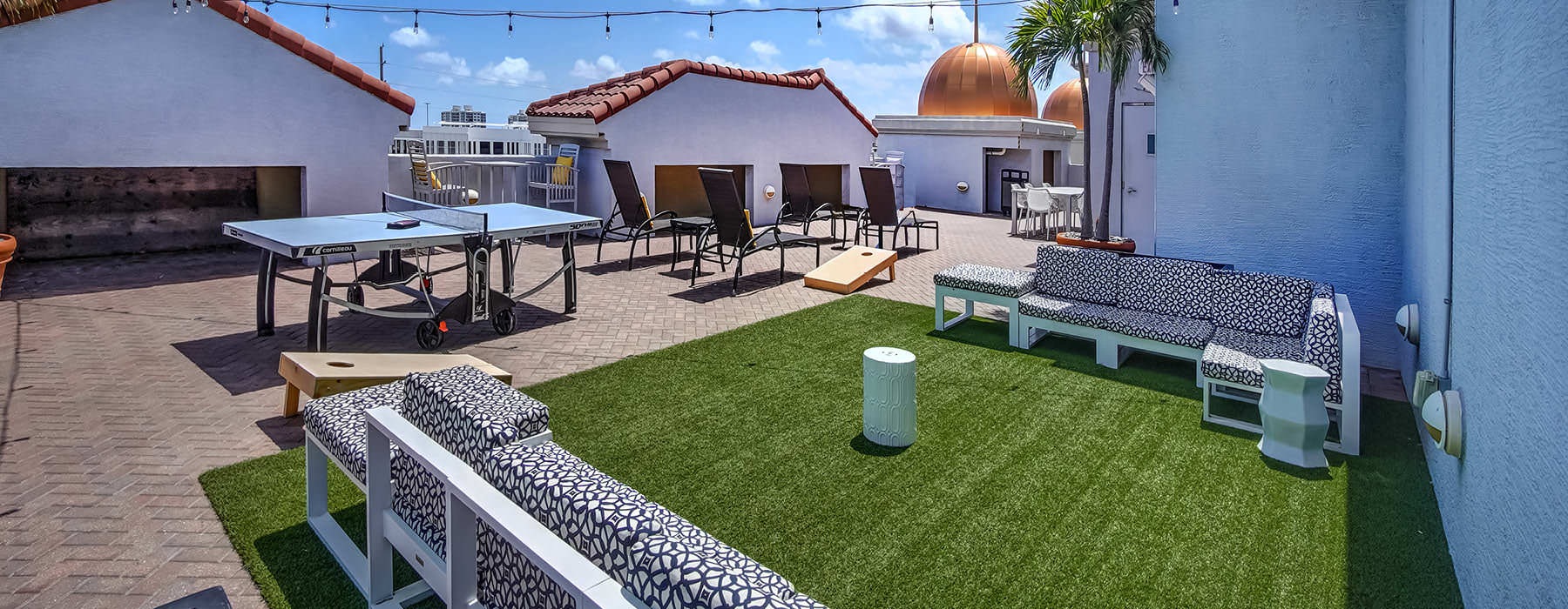 rooftop terrace with ping pong table and sitting areas